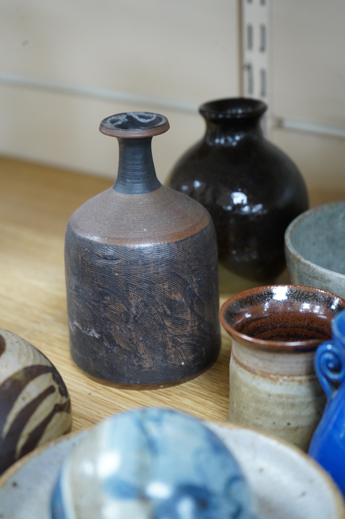 A collection of studio pottery to include a small Danish squat vase, a Brannam, Devon vase and three small Dickerware pieces, largest 13cm high